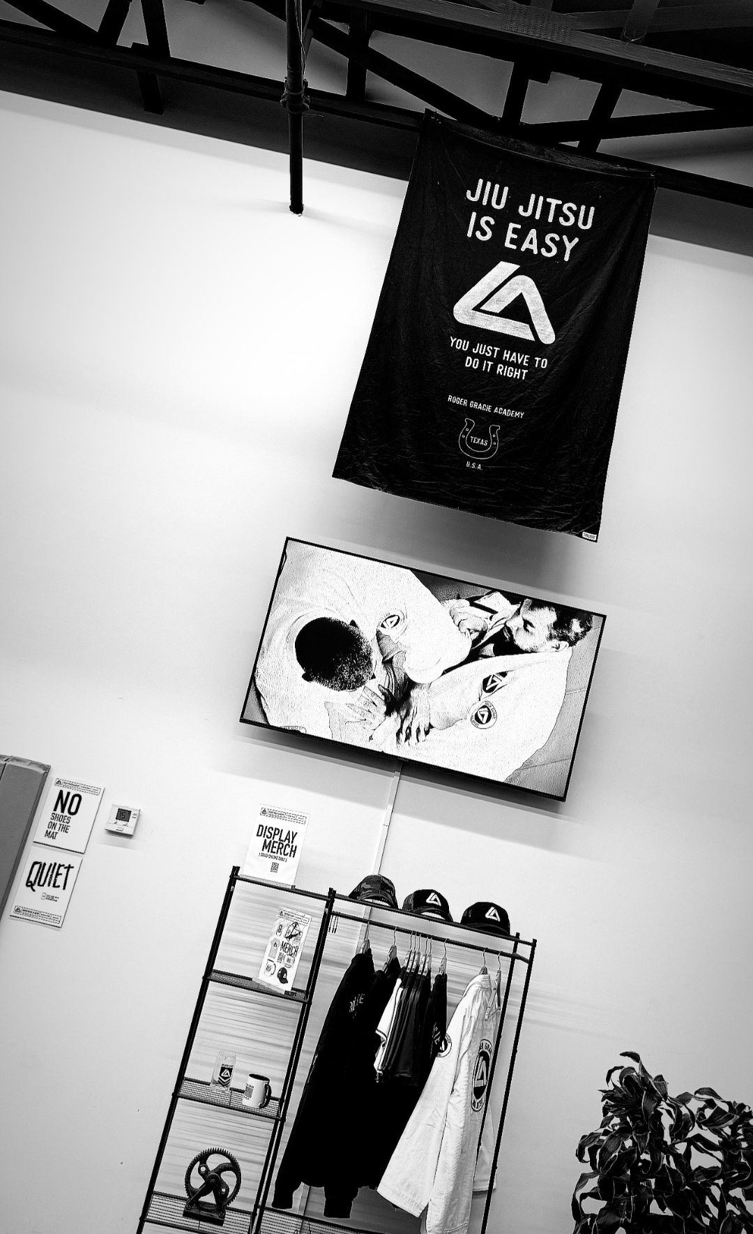 Merch display beneath the academy banner